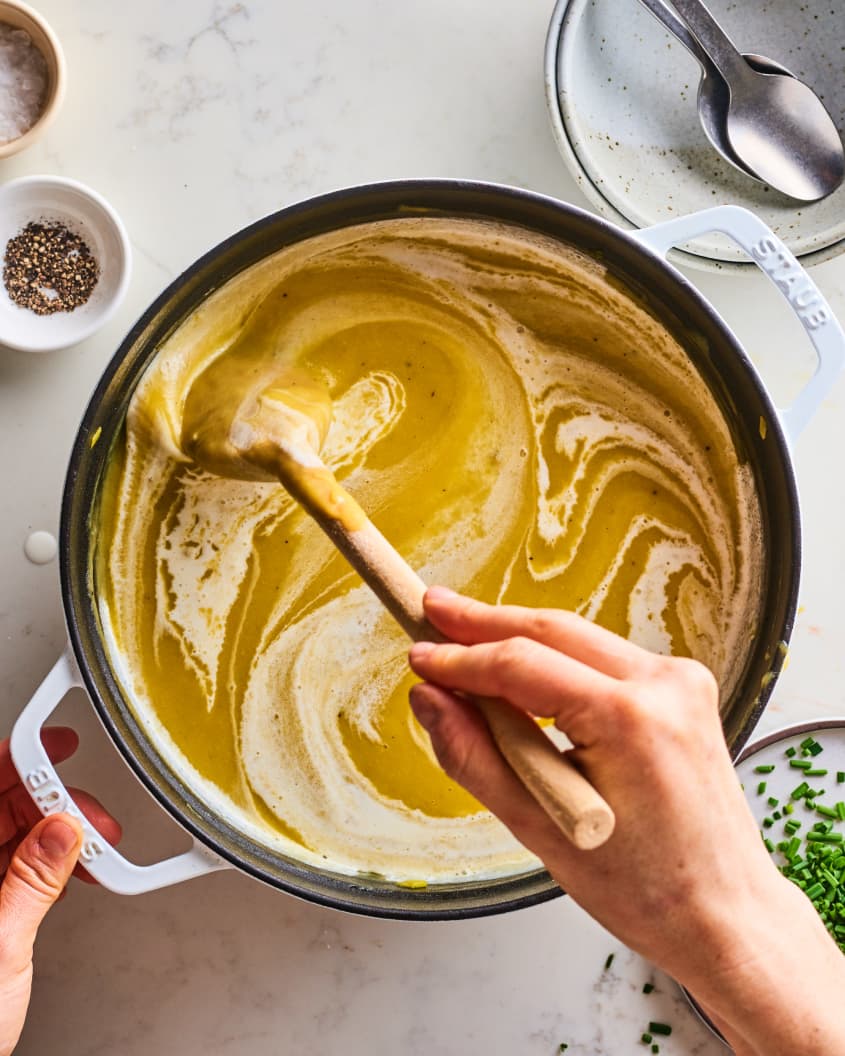 stirring cream into potato leek soup