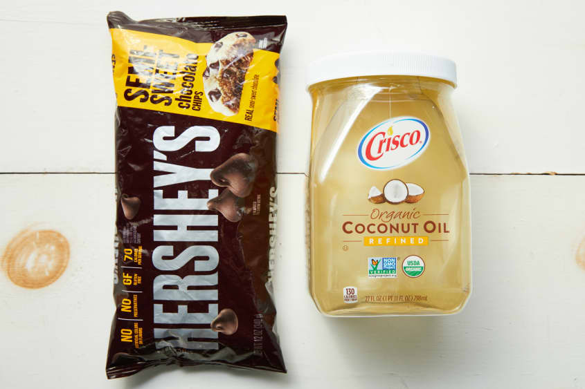 Magic Shell ingredient line up consisting of a bag of Hershey's chocolate chips and Crisco organic coconut oil