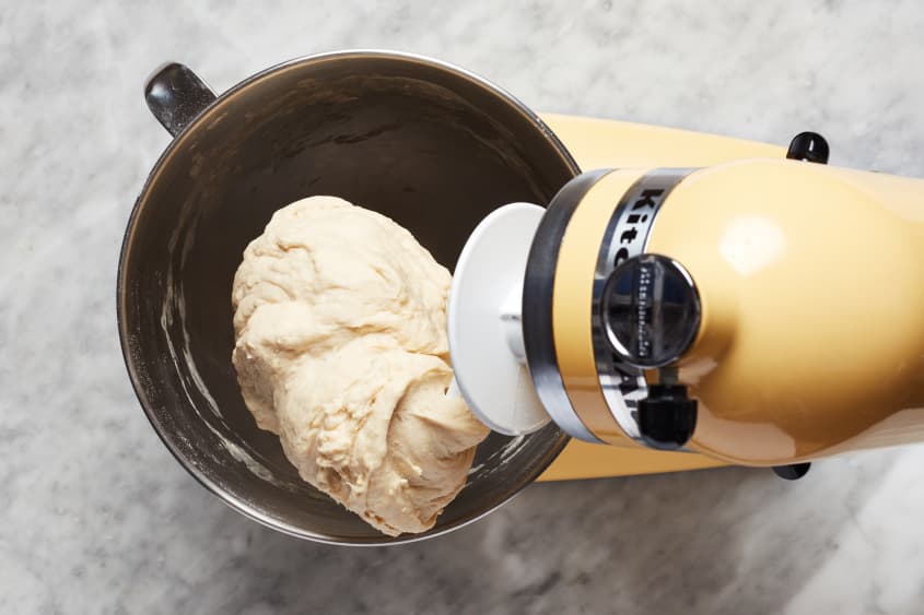 Dough is kneaded with a stand mixer and hook attachment