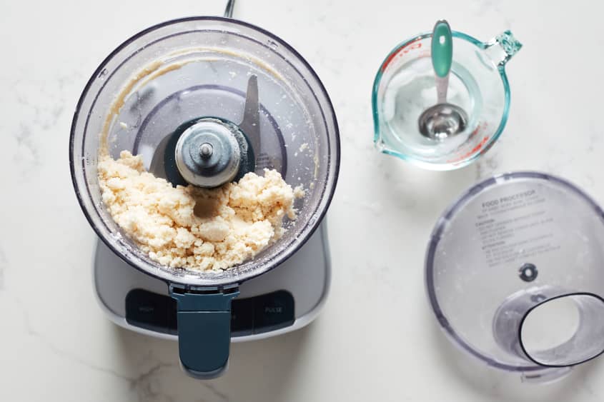 The pie crust ingredients are blended together in a food processor.