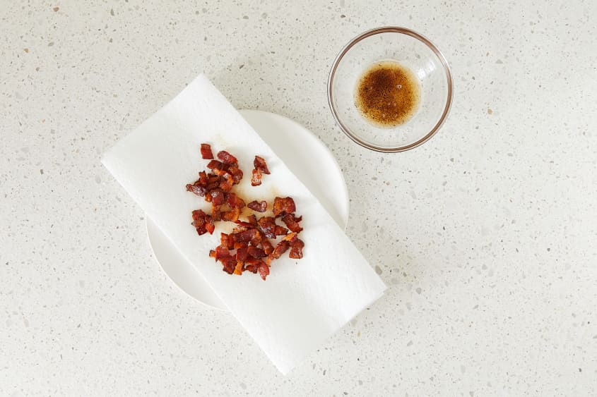Bacon bits draining on paper towel.