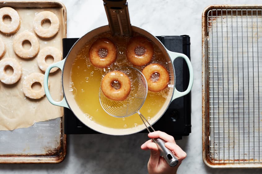 Apple cider donuts in frying oil.