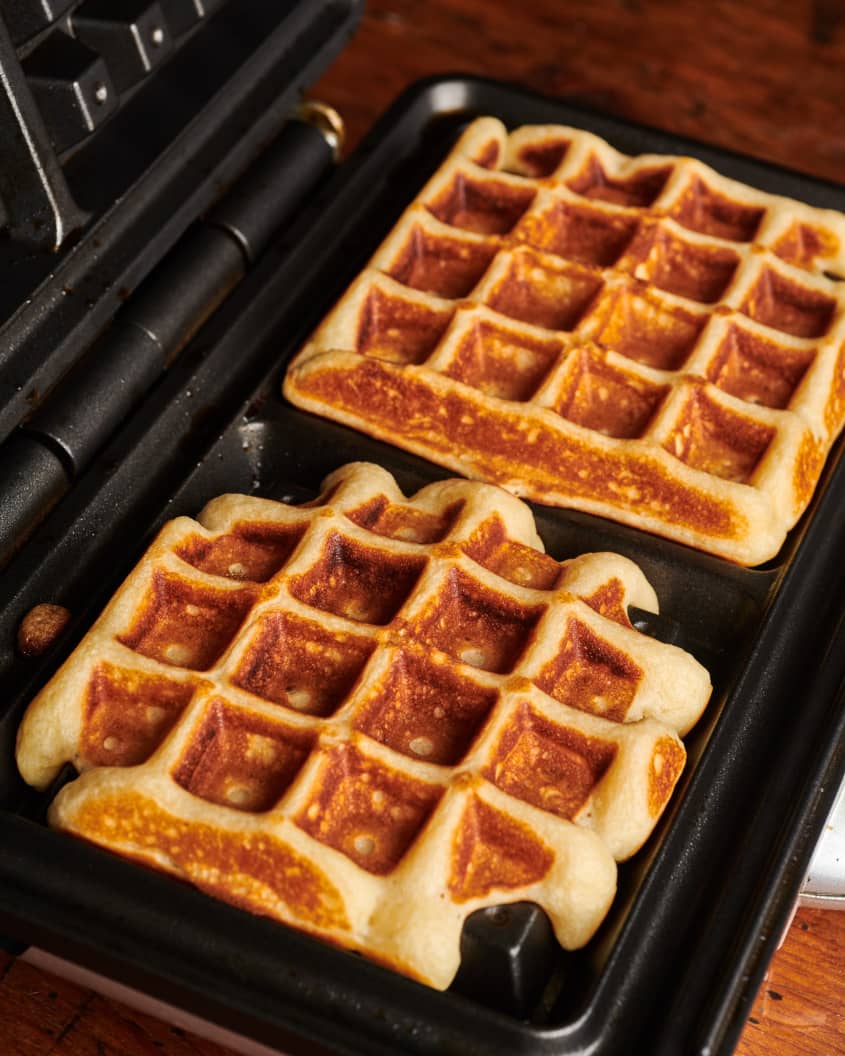 Crisp and fluffy waffles cooked in waffle iron.
