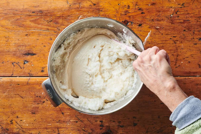 Cake batter being mixed in bowl.