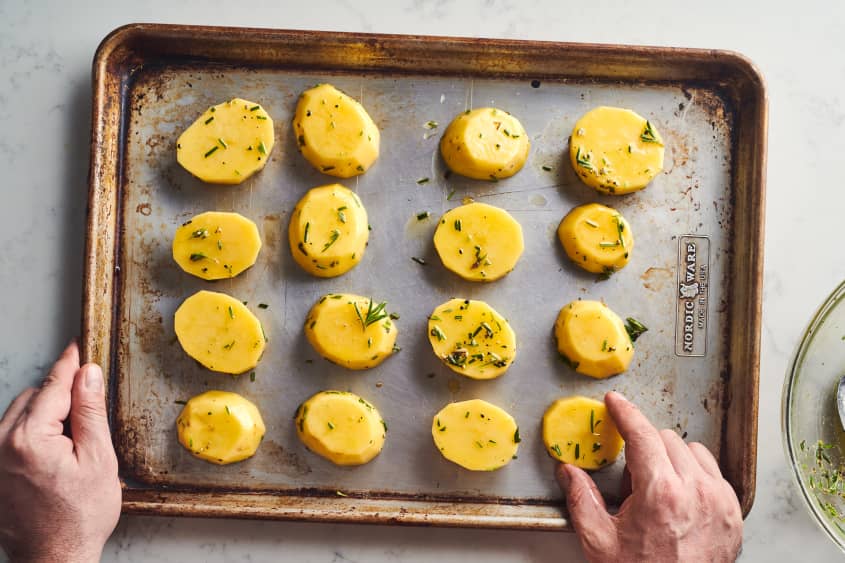 someone is flipping the potatoes with their hand