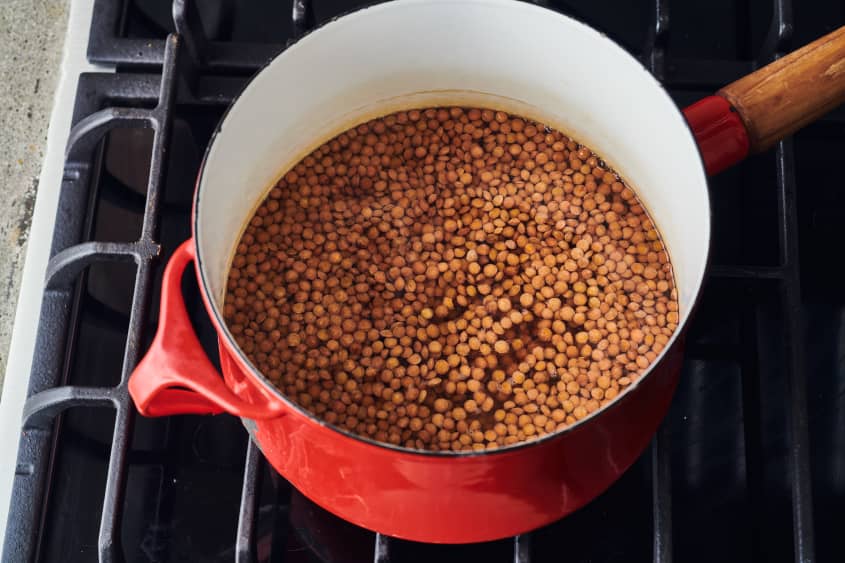 chickpeas are boiling in a pot