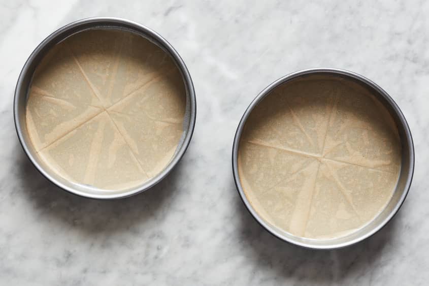 cake tins with parchment paper in them