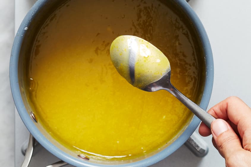 someone is mixing lemon custard with a spoon