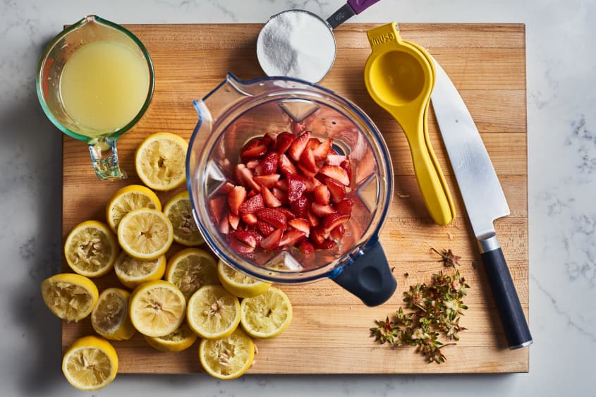 ingredients to strawberry lemonade on cutting board