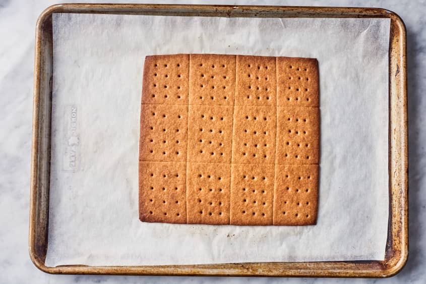 graham crackers sliced on parchment paper