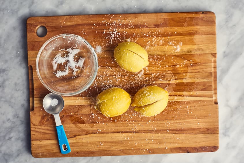salt being put on cut lemons