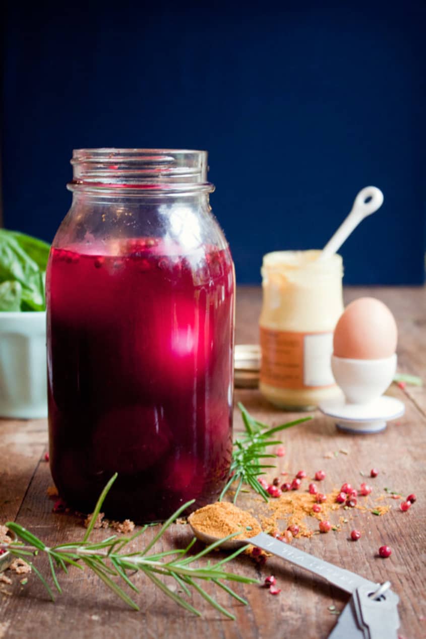 Jar filled with magenta-tinted beet-pickled eggs