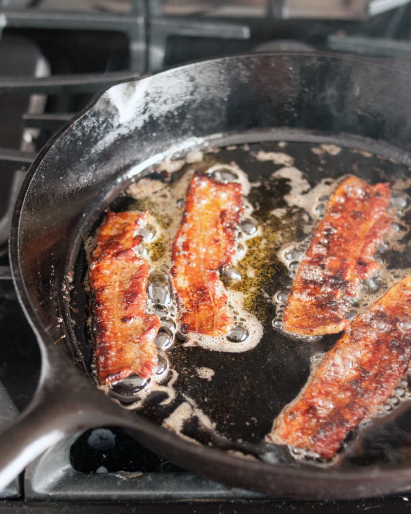 Pan-seared bacon in a cast iron skillet