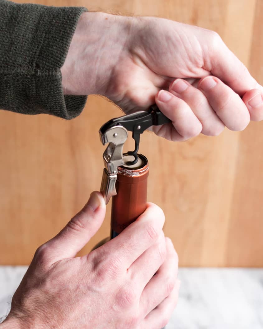 How To Open a Bottle of Wine Using a Wine Key Corkscrew The Kitchn