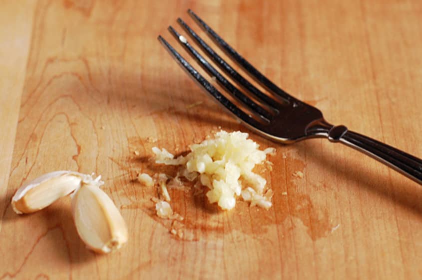 Quick and Easy Shortcut Mince Garlic with a Fork The Kitchn