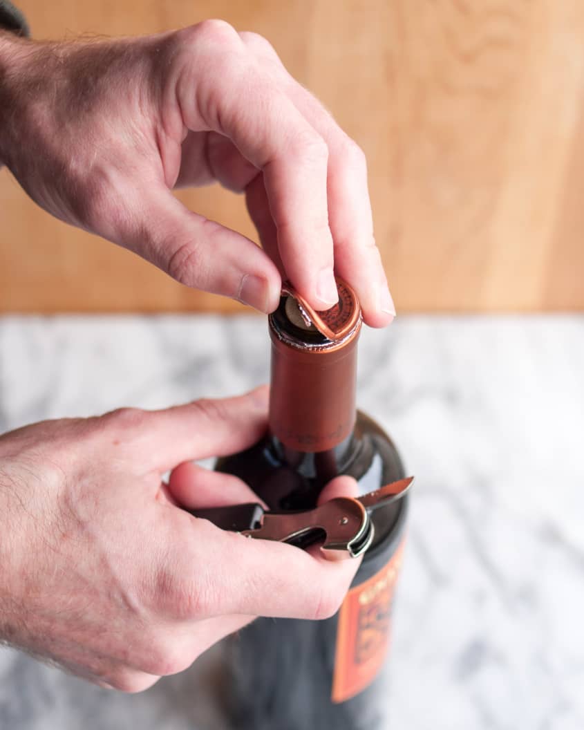 How To Open a Bottle of Wine Using a Wine Key Corkscrew The Kitchn