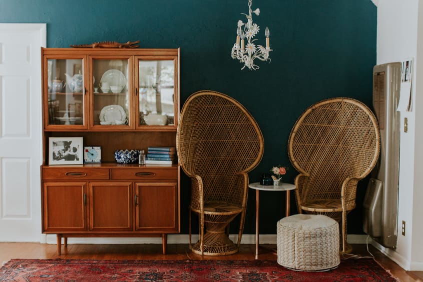 brown furniture with dark green walls