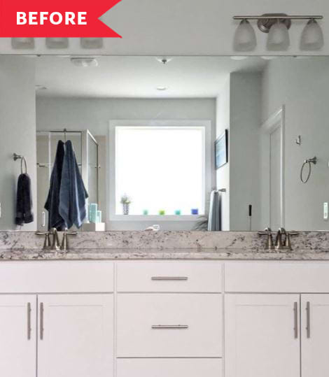 以前:浴室有单片镜子，白色的橱柜，灰色的石头台面