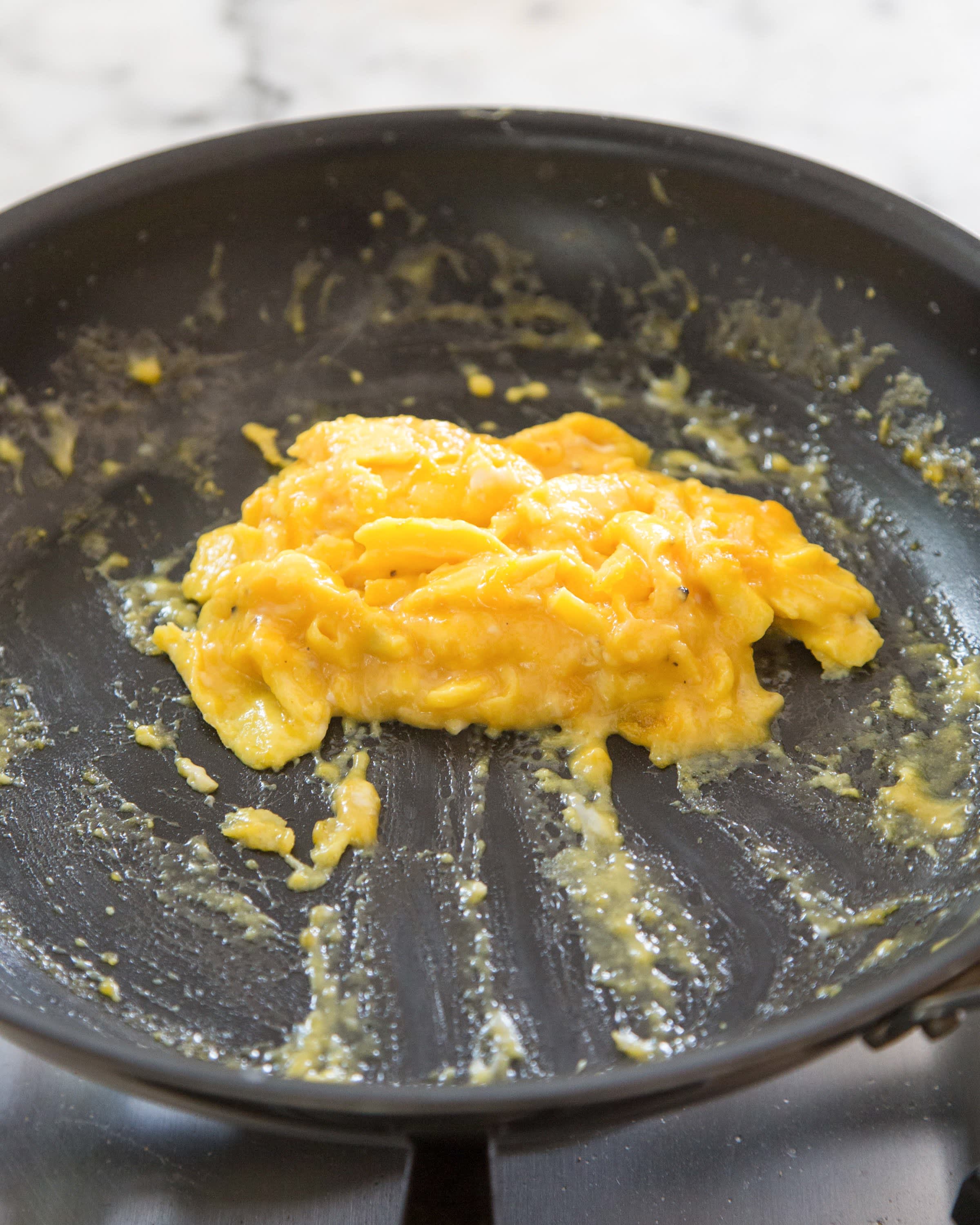 Making scrambled eggs in a pan