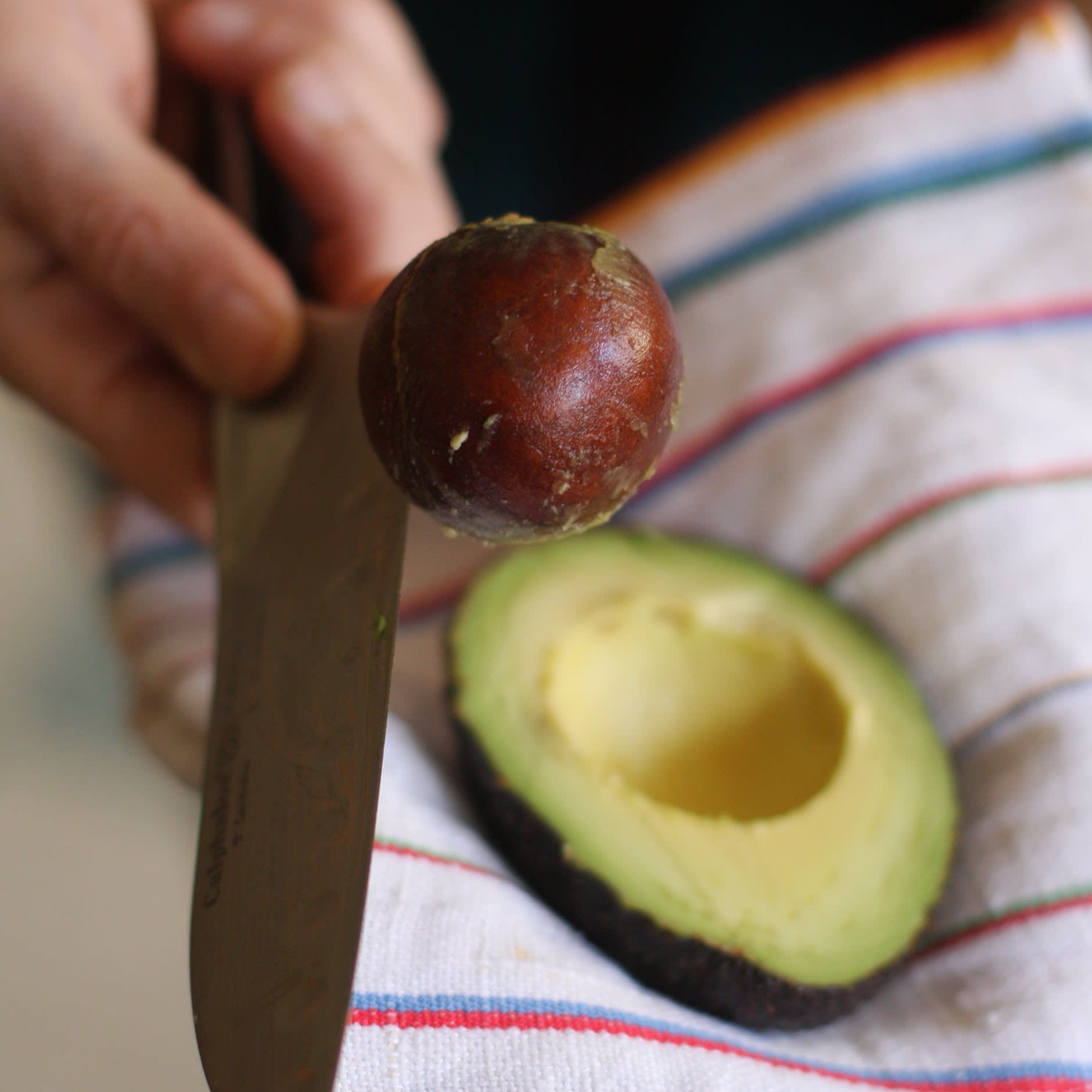 How To Remove An Avocado Pit With A Chef S Knife Kitchn