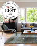 Living room with gray sectional sofa with best list seal in upper left