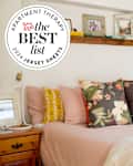 Bed with blush colored jersey sheets and seal in upper left that reads "Apartment Therapy The Best List 2023 Jersey Sheets"