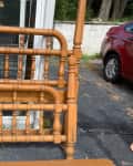 vintage wood bed frames sitting outside