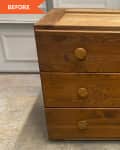 wood dresser sitting in front of garage