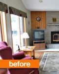 Living room with stone fireplace, green leather sofa, TV, red armchairs, and patterned rug.