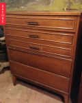 Wooden dresser with five drawers and black handles, labeled "Before" on the left side.
