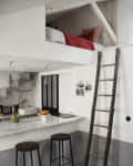Loft bed with red bedding above a kitchen with marble counter, black stools, and a wooden ladder.