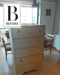 Wooden dresser with mismatched knobs in a dining room with wooden floor, chairs, and a table by a window.