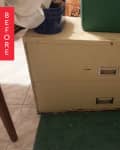 Worn beige filing cabinet with two drawers, green bin on top, and a blue pot beside it.