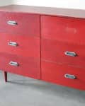 Red wooden dresser with six drawers and metal handles, labeled "Before."