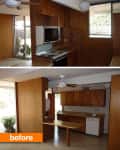 Wood-paneled kitchen with ceiling fans, built-in oven, and dishwasher, featuring large windows and a small breakfast bar.