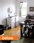Cluttered living room with bookshelves, a white cabinet, and green curtains on two windows.