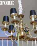 Brass chandelier with black lampshades hanging in a stairwell, labeled "Before."