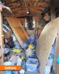 Cluttered shed interior with scattered tools, plywood, and storage bins.