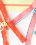 4 different pastel-colored zippers