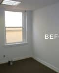 Empty room with white walls, a window, and a paint can on the floor labeled "BEFORE."