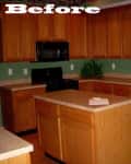 Kitchen with oak cabinets, black appliances, green walls, and a wooden chair, labeled "Before."