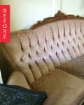 Vintage tufted sofa with ornate wooden frame and patterned upholstery.