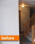 Staircase with wooden railing in a dimly lit hallway, labeled "before."
