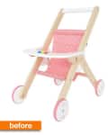Wooden toy stroller with pink fabric seat, white tray, and pink wheels.