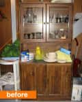 Wooden cabinet with glassware, dishes,