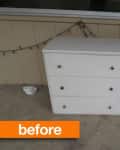 White dresser with three drawers and a cabinet door, labeled "before," on a patio with string lights.