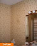 Bathroom with floral wallpaper, vanity mirror, striped shower curtain, and tissue box on counter.