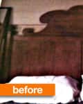 Wooden headboard with ornate design above two white pillows.