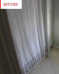 Small bathroom with a shower curtain, toilet, and window blinds.