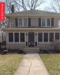 Two-story house with beige siding, black shutters, and a front porch, labeled "Before" in red.